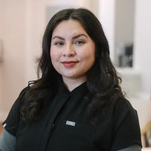 Elena, Lead Dental Assistant at Snellville dental practice, smiles for professional headshot.