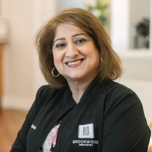 Sonia, Office Manager at Brookwood Dentistry in Snellville, GA, smiling at camera.